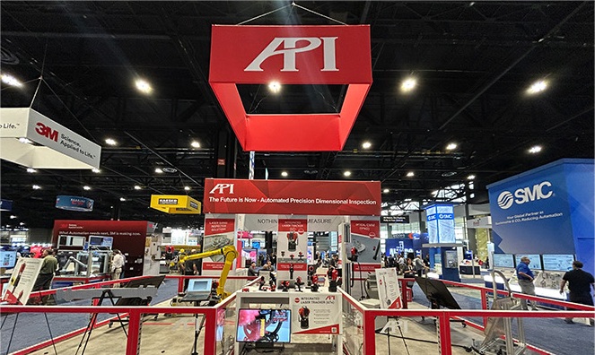 API Metrology trade-show booth with overhead signage